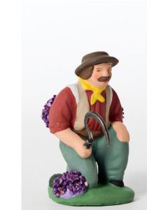 Santon Man picking up lavender