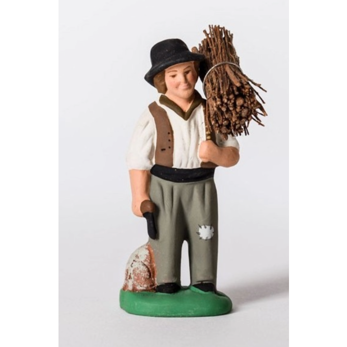 Painted santon young man carrying firewood