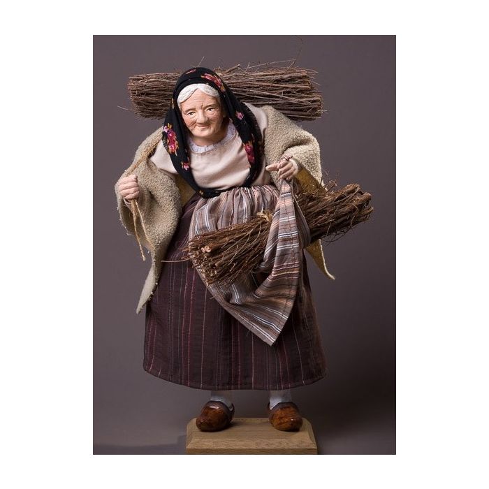 Dressed Santon Woman carrying firewood